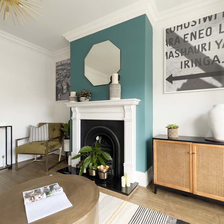 Living room with feature chimney breast and modern furniture in a Bedminster townhouse by Ivywell Interiors